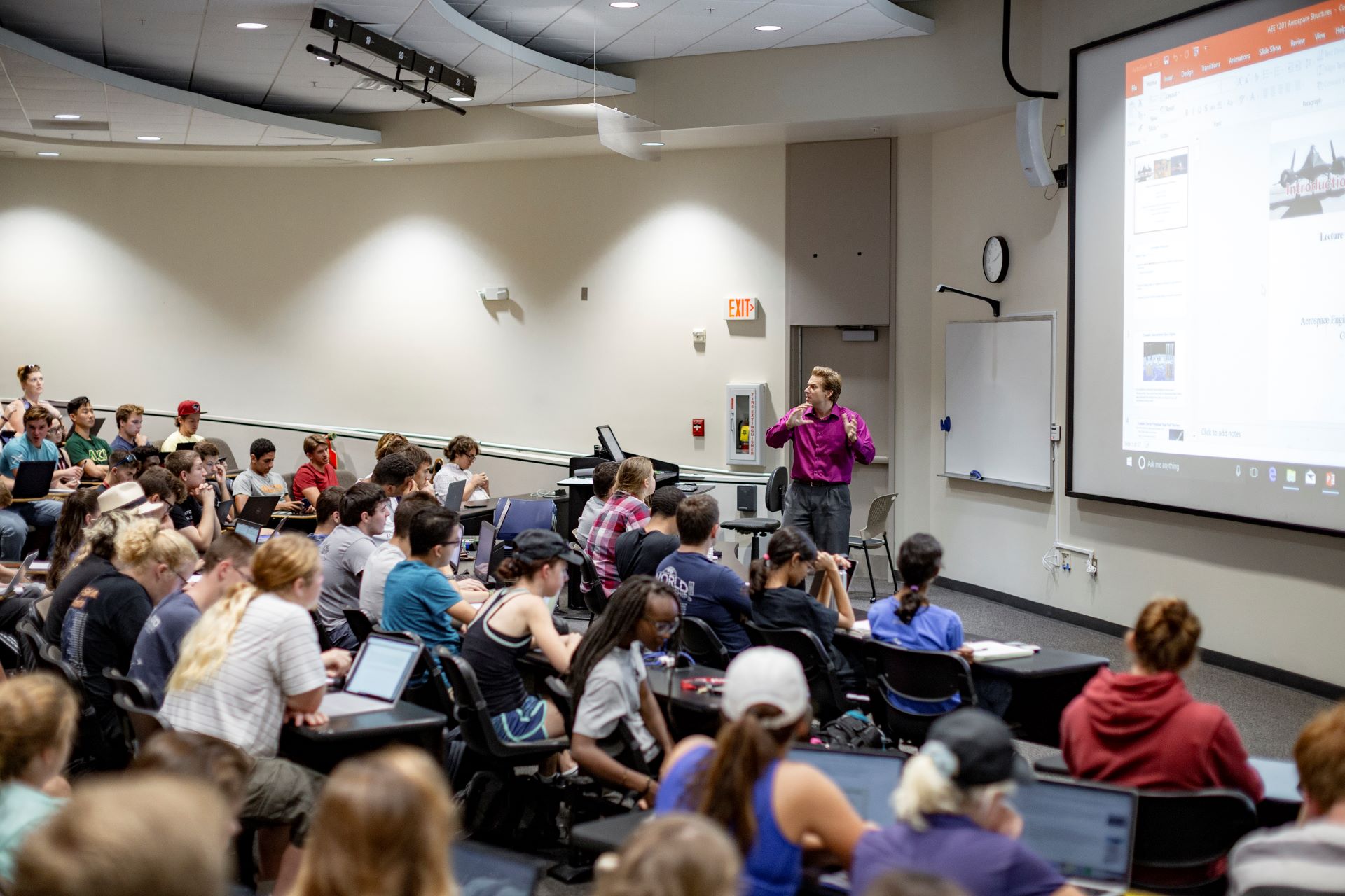 Classroom full of students with a lecturer at the front
